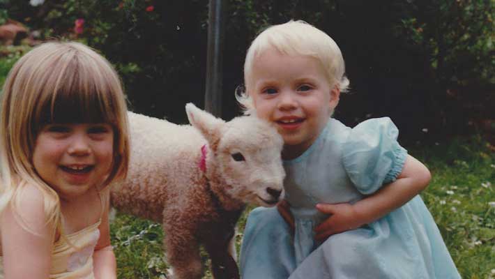 Lydia Tong (left) with her sister, growing up in rural New Zealand