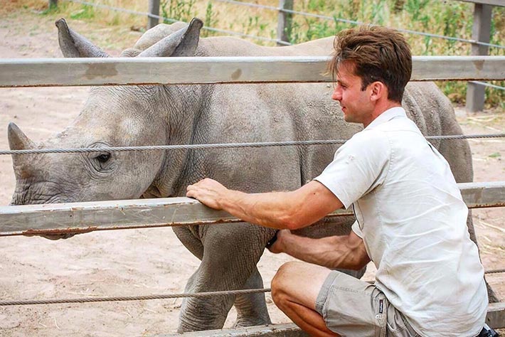 Keeper Maz Boz with a baby Rhino at Taronga Western Plains Zoo